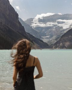 Girl standing at Lake Louise in Banff Canada