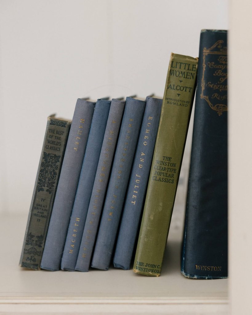 vintage books on a white bookshelf